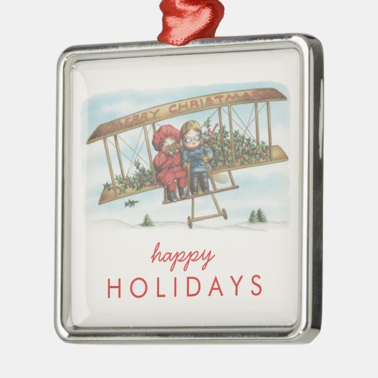 ヴィンテージのクリスマスのヒイラギのかわいい子供の飛行機の休日 メタルオーナメント (左)
