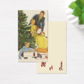 ヴィンテージのクリスマスの朝、家族でプレゼントを開ける (デスク)