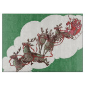 ヴィンテージのクリスマスイブ、レトロなサンタクロースのソリ カッティングボード (正面)