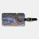 ヴィンテージのクリスマス サンタクロースがトナカイと共にソリを飛ばす ラゲッジタグ (正面横)