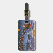 ヴィンテージのクリスマス サンタクロースがトナカイと共にソリを飛ばす ラゲッジタグ (正面縦)