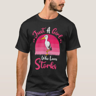 ヴィンテージのコウノトリを愛する少女 Tシャツ