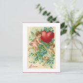 ヴィンテージのハートを保持しているビクトリアンなバレンタインの天使 シーズンポストカード (スタンド正面)