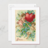 ヴィンテージのハートを保持しているビクトリアンなバレンタインの天使 シーズンポストカード (正面/裏面)