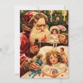 ヴィンテージの不気味なクリスマス・サンタが人形を子どもにかける シーズンカード (正面)