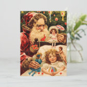 ヴィンテージの不気味なクリスマス・サンタが人形を子どもにかける シーズンカード (スタンド正面)