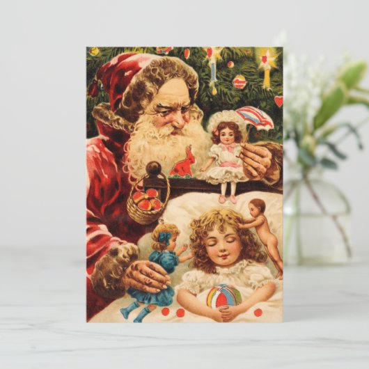 ヴィンテージの不気味なクリスマス・サンタが人形を子どもにかける シーズンカード (スタンド正面)