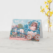 ヴィンテージの可愛い女の子のイースターエッグのキャリッジby Lambs カード (黄色い花)