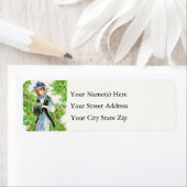 ヴィンテージの女性がヒイラギで飾られたクリスマスドレス ラベル (インサイチュ)