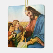 ヴィンテージの子どもがイエス・キリストに花を持って来る セラミックオーナメント (左)