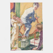 ヴィンテージクリスマスの朝、プレゼントを持つ子供たち キッチンタオル (縦)