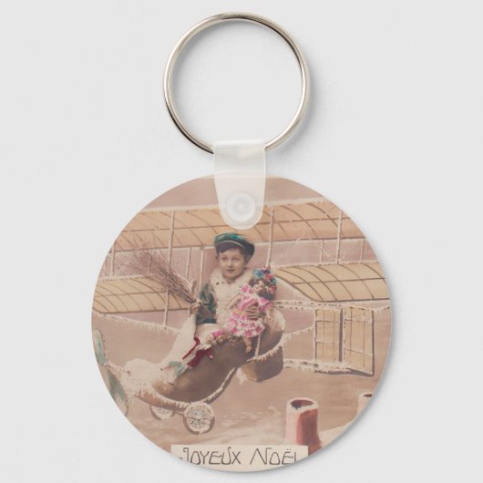 ヴィンテージクリスマスボーイ飛んでいる飛行船ファンタジー キーホルダー (正面)