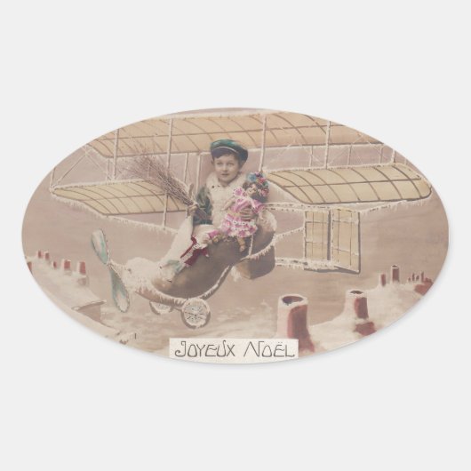 ヴィンテージクリスマスボーイ飛んでいる飛行船ファンタジー 楕円形シール (正面)
