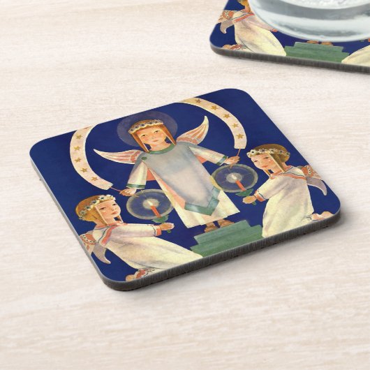 ヴィンテージクリスマス、スカンジナビアのサンタ・ルシア・エンジェル コースター (左側)