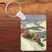 ヴィンテージクリスマス、山で子どもそり キーホルダー (正面)