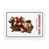 ヴィンテージサンタが心地よい椅子に座るクリスマス マグネット (横)