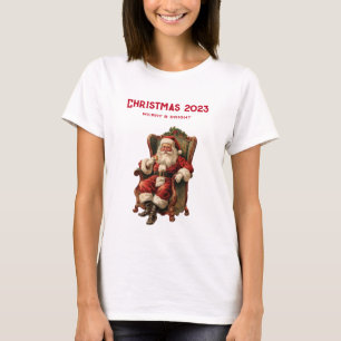 ヴィンテージサンタが心地よい椅子に座るクリスマス Tシャツ