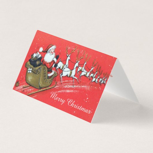 ヴィンテージサンタクロースがそりにトナカイを持つ (正面)