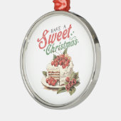 ヴィンテージスタイルは甘いクリスマスケーキを持っている メタルオーナメント (左)