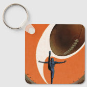 ヴィンテージスポーツ，サッカー選手がボールを蹴る キーホルダー (正面)