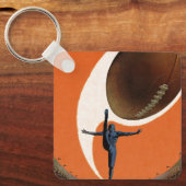 ヴィンテージスポーツ，サッカー選手がボールを蹴る キーホルダー (正面)