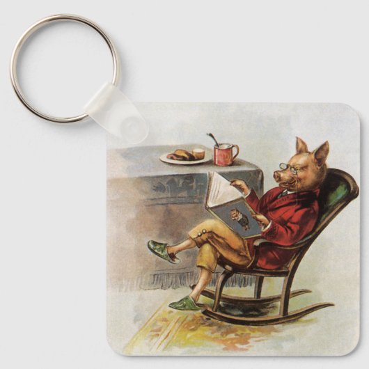 ヴィンテージユーモア、ロッキングチェア読の豚の本 キーホルダー (正面)