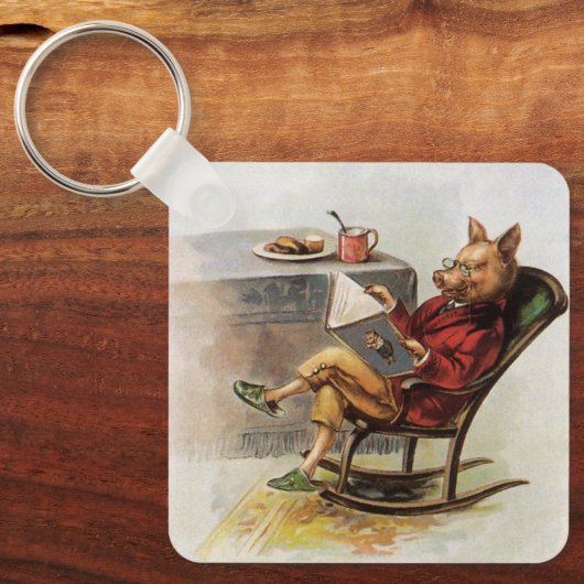 ヴィンテージユーモア、ロッキングチェア読の豚の本 キーホルダー (正面)