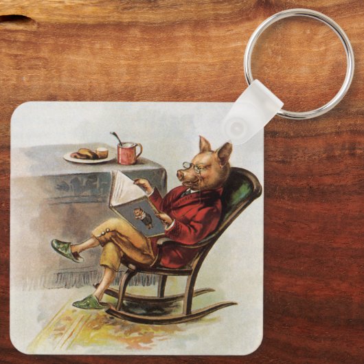 ヴィンテージユーモア、ロッキングチェア読の豚の本 キーホルダー (裏面)