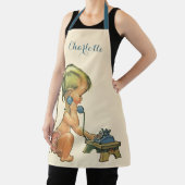 ヴィンテージ子おもちゃ電話で話すかわいい金髪の女の子 エプロン (インサイチュ)