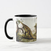 ヴィンテージ恐竜、木の上に放牧 マグカップ (左)