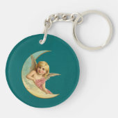 ヴィンテージ画像 – 天使が三日月に座る キーホルダー (裏面)
