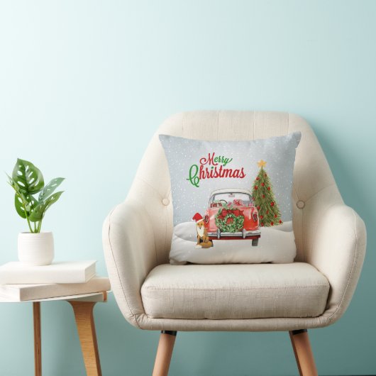 ヴィンテージ車はクリスマスツリーおよび孤のsittiによって駐車しました クッション (椅子)