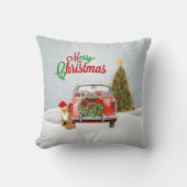 ヴィンテージ車はクリスマスツリーおよび孤のsittiによって駐車しました クッション (正面)