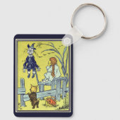 ヴィンテージ魔法使いのドロシー・トト、かかしに会う キーホルダー (裏面)