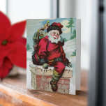ヴィンテージSanta w/Chimney Non-Photo Holiday Card ノートカード<br><div class="desc">この甘い非写真のホリデーカードは、サンタクロースのヴィンテージイラストレーションの煙突を下り、カードの前面に子供たちのための玩具で彼のサックを満たす。中には赤い台本の中に「メリークリスマス」と書かれた挨拶があり、その下に君の名前と年が書いてある。反対側のページにも写真の余地がある。</div>