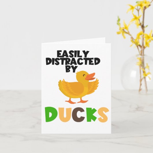 一列に並んだアヒルに得気が散りやすい カード (黄色い花)