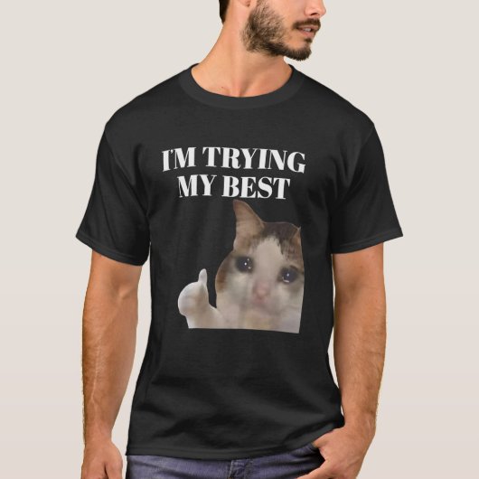 一生懸命頑張ってる面白い泣き猫ミーム Tシャツ (正面)