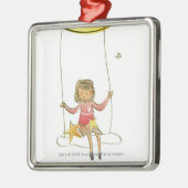 三日月形の月からつるすロープで振れている女の子 メタルオーナメント (左)