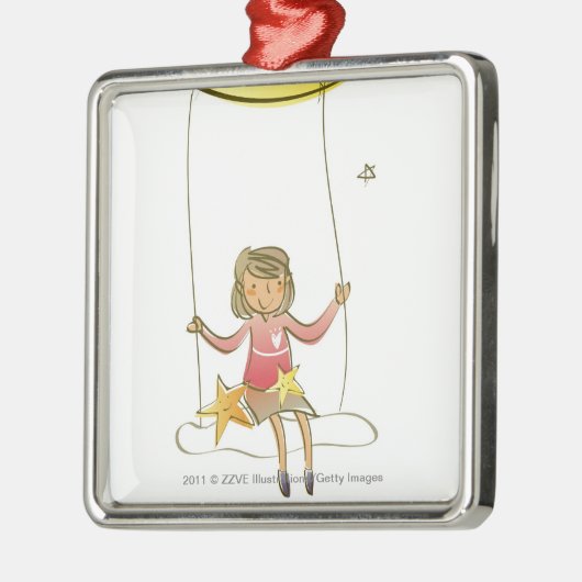 三日月形の月からつるすロープで振れている女の子 メタルオーナメント (左)