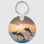 三頭のイルカが日没を見て飛び跳ねた。 キーホルダー (正面)