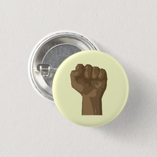 上げられた黒い握りこぶし 缶バッジ (正面&裏面)