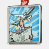 上で新聞および飛行機を持つビジネスマン メタルオーナメント (左)