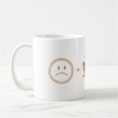 不機嫌な顔+コーヒー=幸せな顔 コーヒーマグカップ (左)