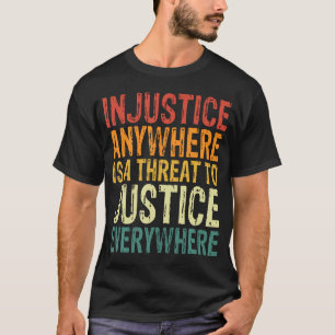 不正はどこにいても正義を脅かす Tシャツ