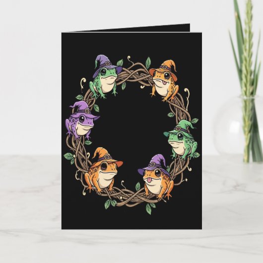 不気味なカエルの装飾が施された、気まぐれな花輪の境界 シーズンカード (正面)