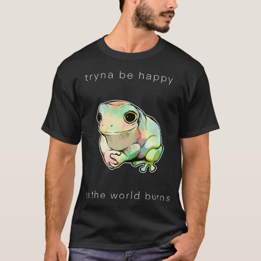 世界が燃え尽きる中幸せを求めるカエル Tシャツ (正面)