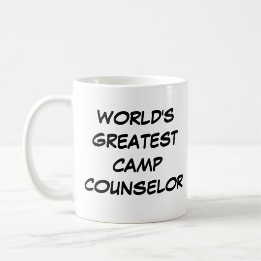 「世界で最も偉大なキャンプ・カウンセラー」マググ コーヒーマグカップ (左)