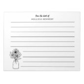 並んだ机の上の黒と白の野花 ノートパッド (正面)