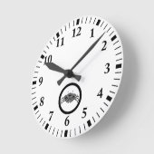 丸い頭に乗ったアシガニ ラウンド壁時計 (傾斜)