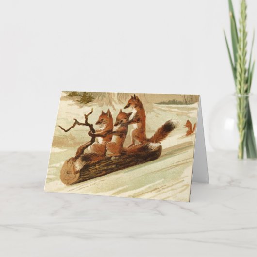 丸太のSLEDDINGの折られたクリスマスカードのキツネ カード (正面)